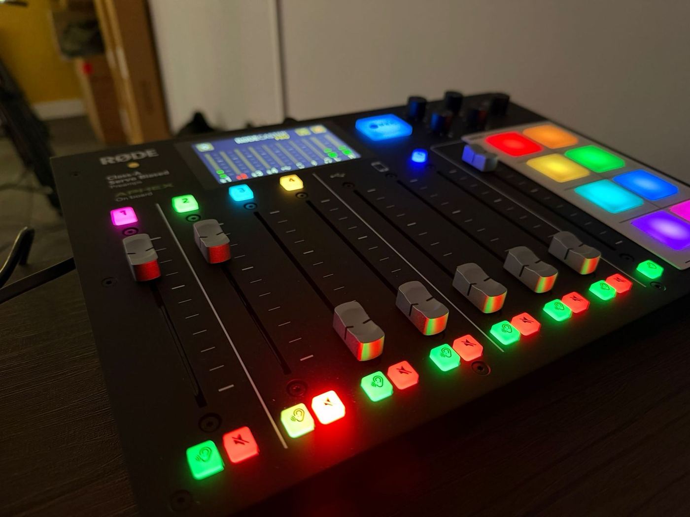 The RØDECaster Pro mixing desk lit up